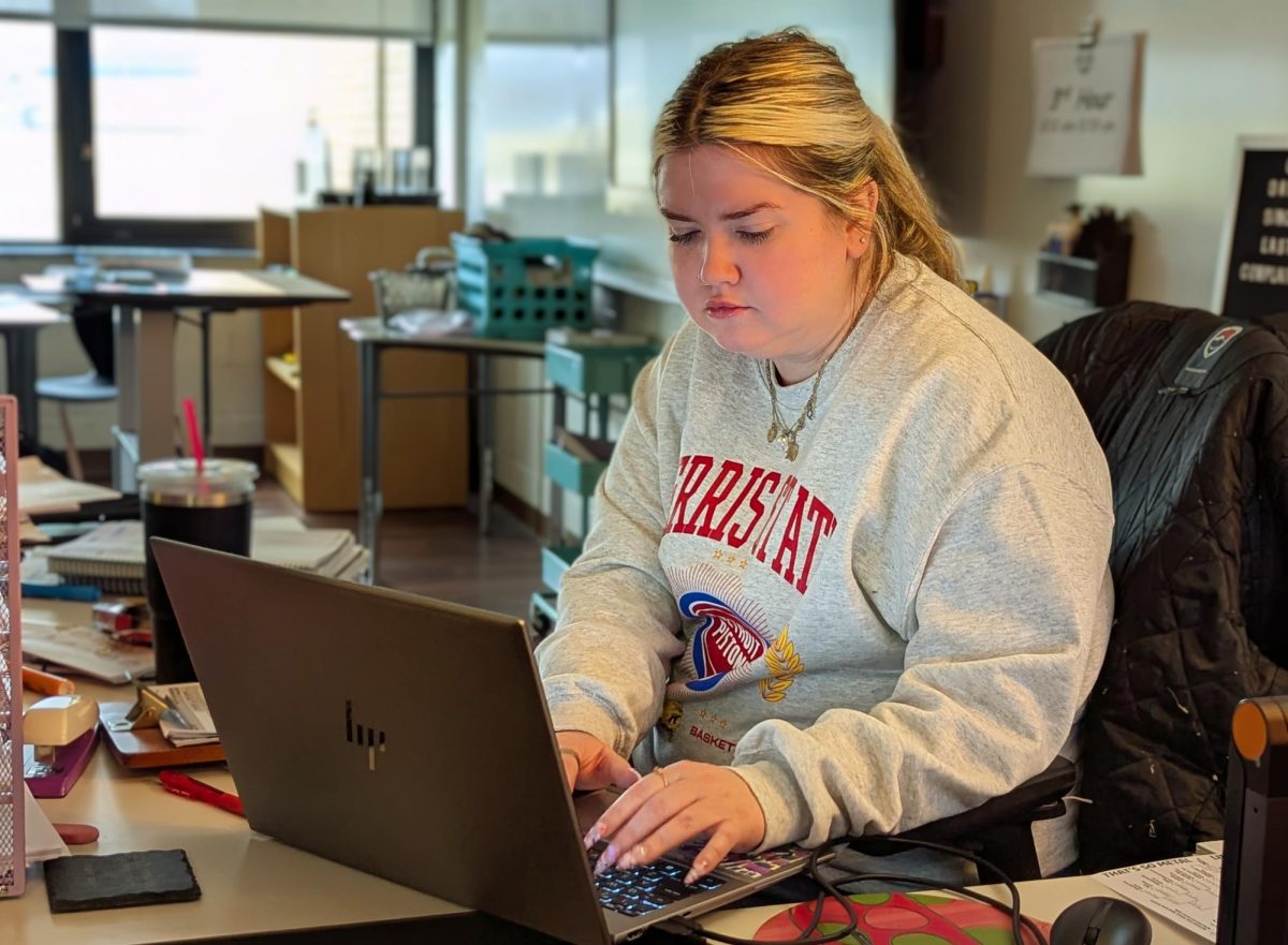 Ms. Dunn working on her laptop